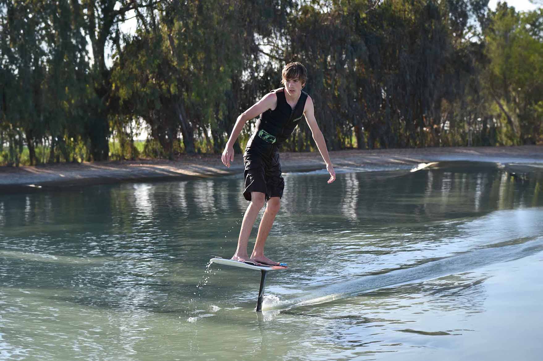 beginner learning to surf foil